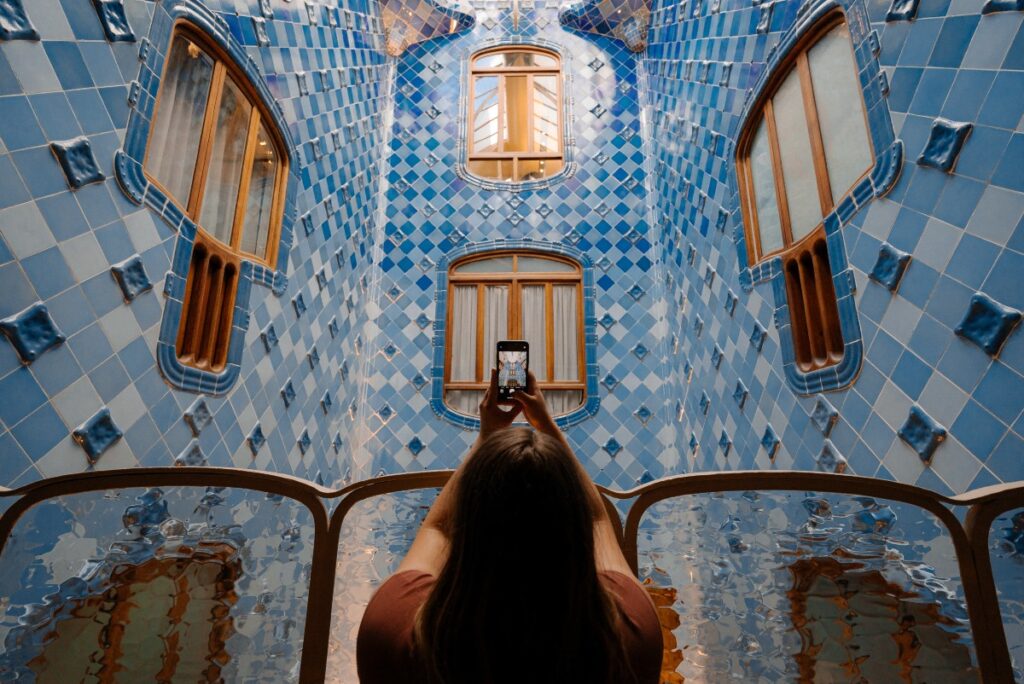 A woman taking a selfie of a building