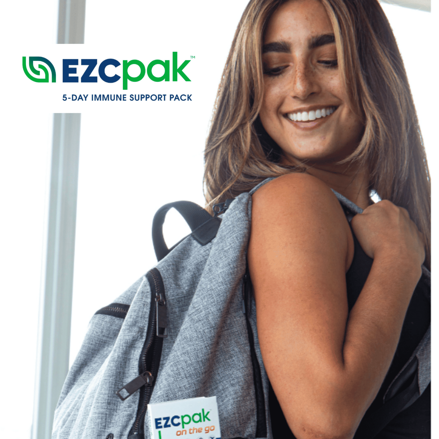 Woman with backpack and EZC Pak logo
